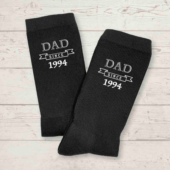 Personalized black crew socks for dad with the established date added to the design