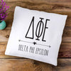 Delta Phi Epsilon sorority letters and name in boho style design custom printed on white or natural cotton throw pillow cover.