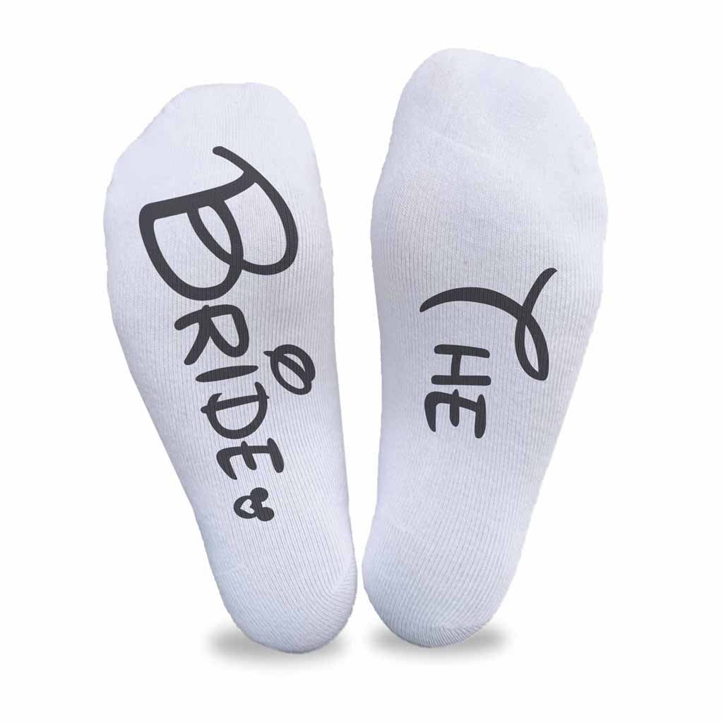 Personalized wedding party role socks with a Disney inspired font digitally printed on the bottom soles of the no show socks.