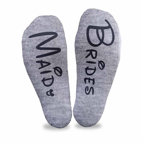 Personalized wedding party role socks with a Disney inspired font digitally printed on the bottom soles of the no show socks.