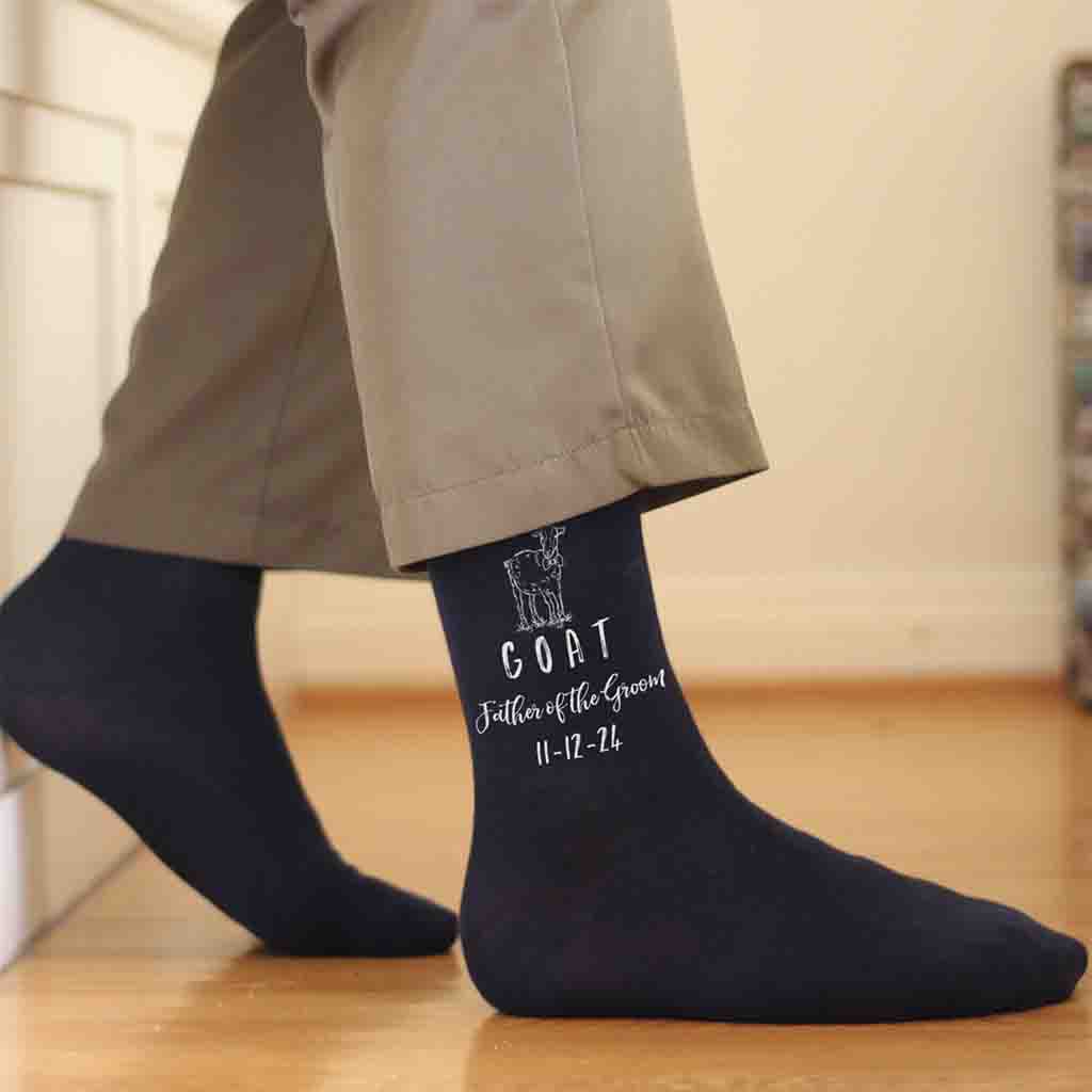 Fun personalized wedding socks for the GOAT father of the groom custom printed and personalized with your wedding date make these the perfect wedding accessory keepsake gift.