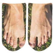 Mens feet in grass custom design by sockprints is digitally printed on the top of no show cotton socks.