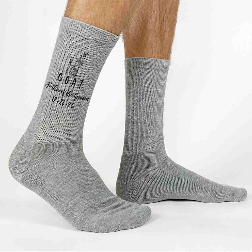 Fun personalized wedding socks for the GOAT father of the groom custom printed and personalized with your wedding date make these the perfect wedding accessory keepsake gift.