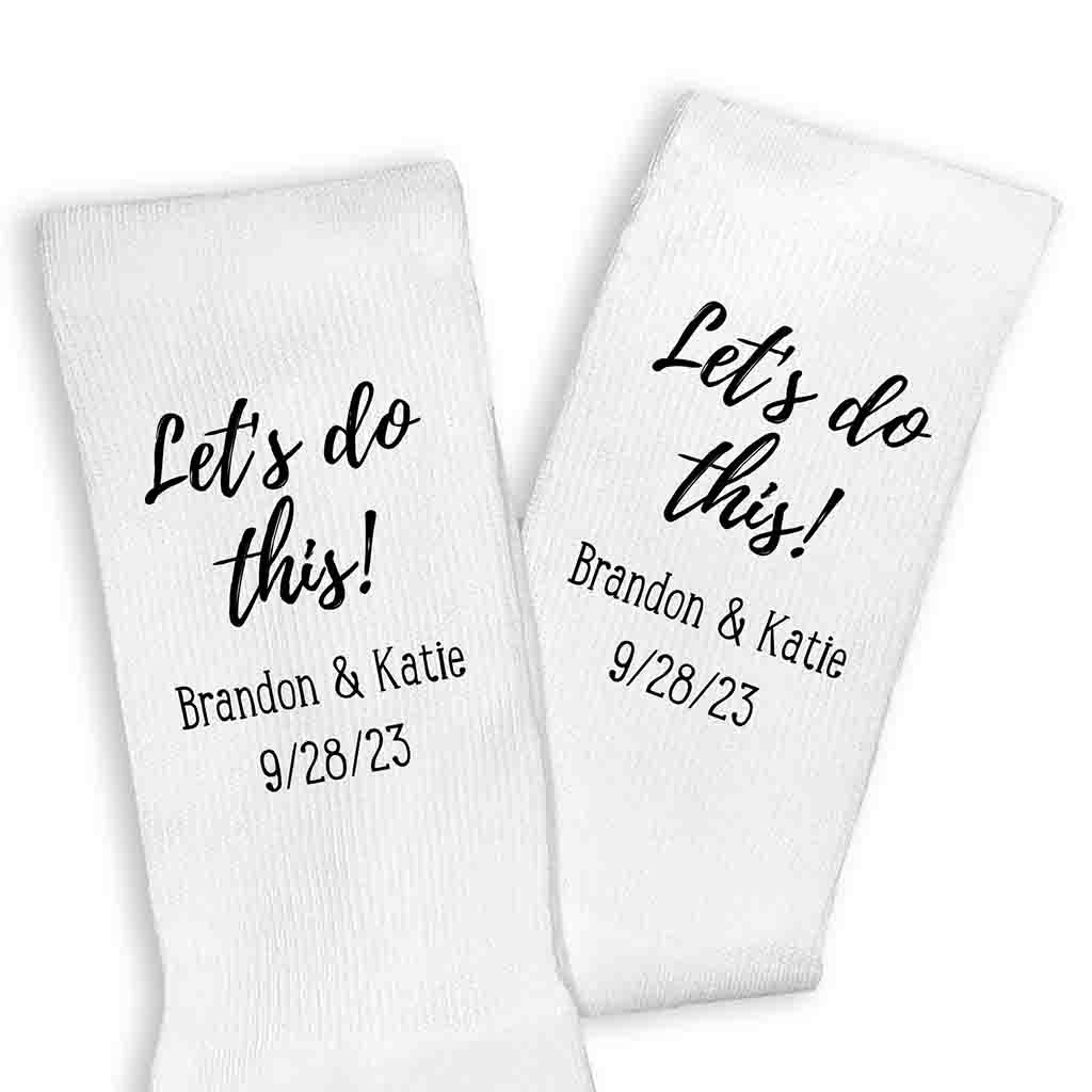 Personalized wedding day socks custom printed for the groom personalized with your names and wedding date digitally printed on the side of the white cotton crew socks.