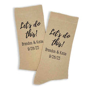 Personalized wedding day socks custom printed for the groom personalized with your names and wedding date digitally printed on the side of the tan dress socks.