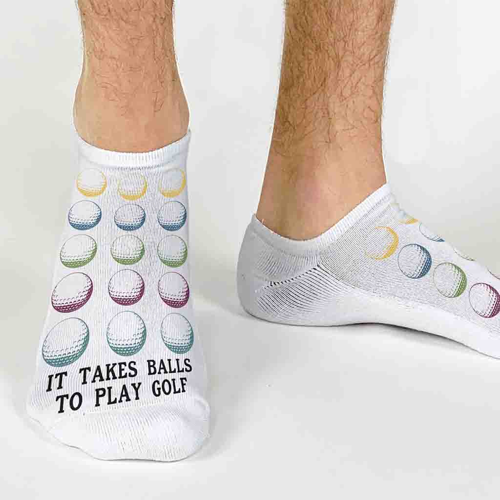 Original golf ball design by sockprints digitally printed on no show socks with It takes balls to play golf on the top of the no show socks is the perfect accessory for any golfer.
