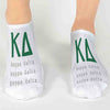 Kappa Delta sorority letters and name digitally printed in sorority colors on white no show socks.
