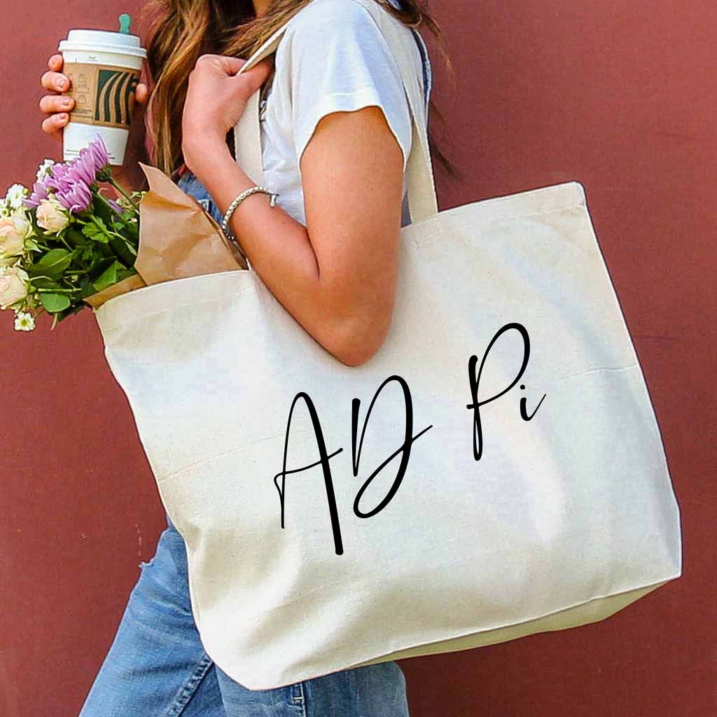 AD Pi sorority nickname digitally printed on canvas tote bag in script writing is a the perfect accessory for the new semester.