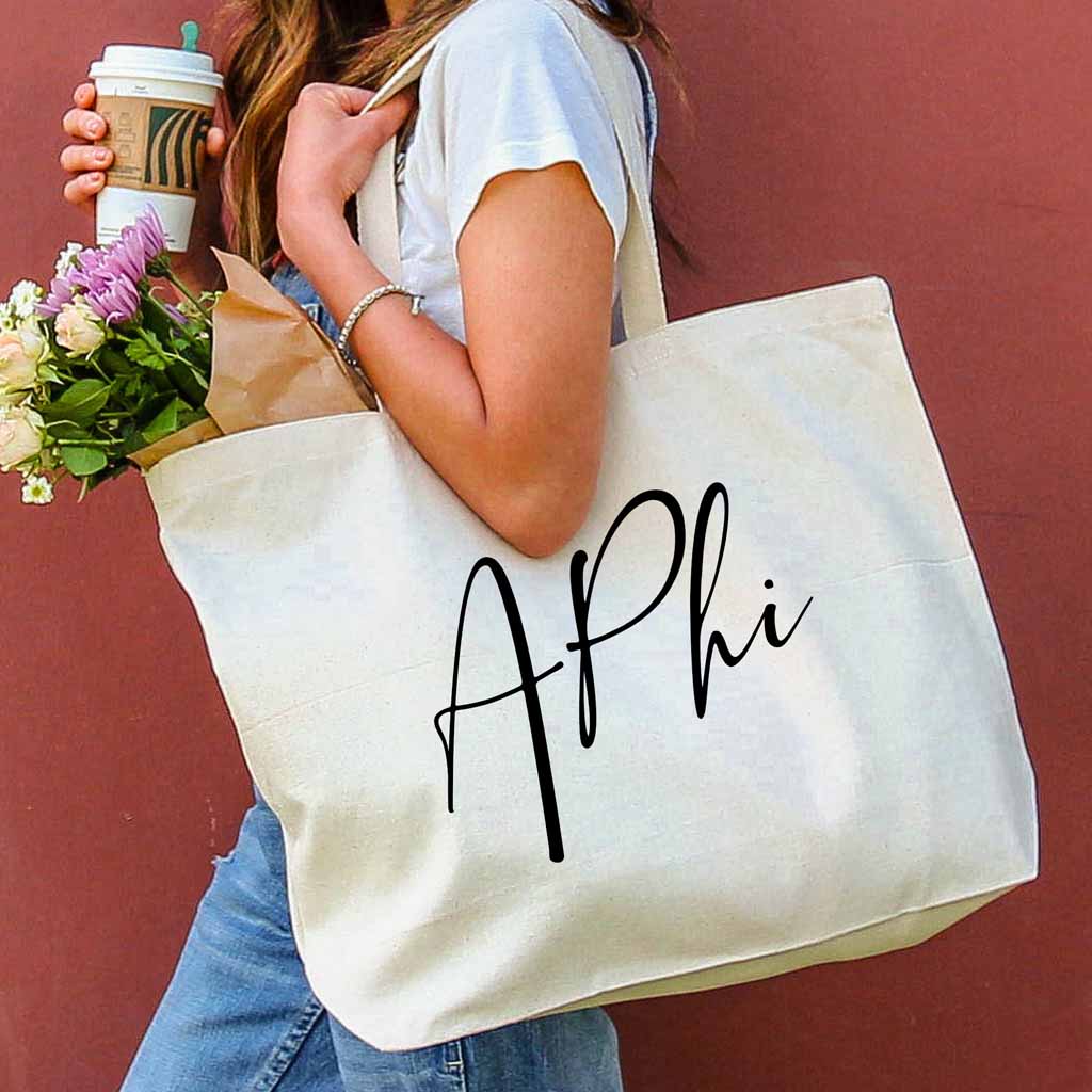 Alpha Phi sorority nickname printed on a canvas tote bag in script writing is a great gift for your sorority sisters.