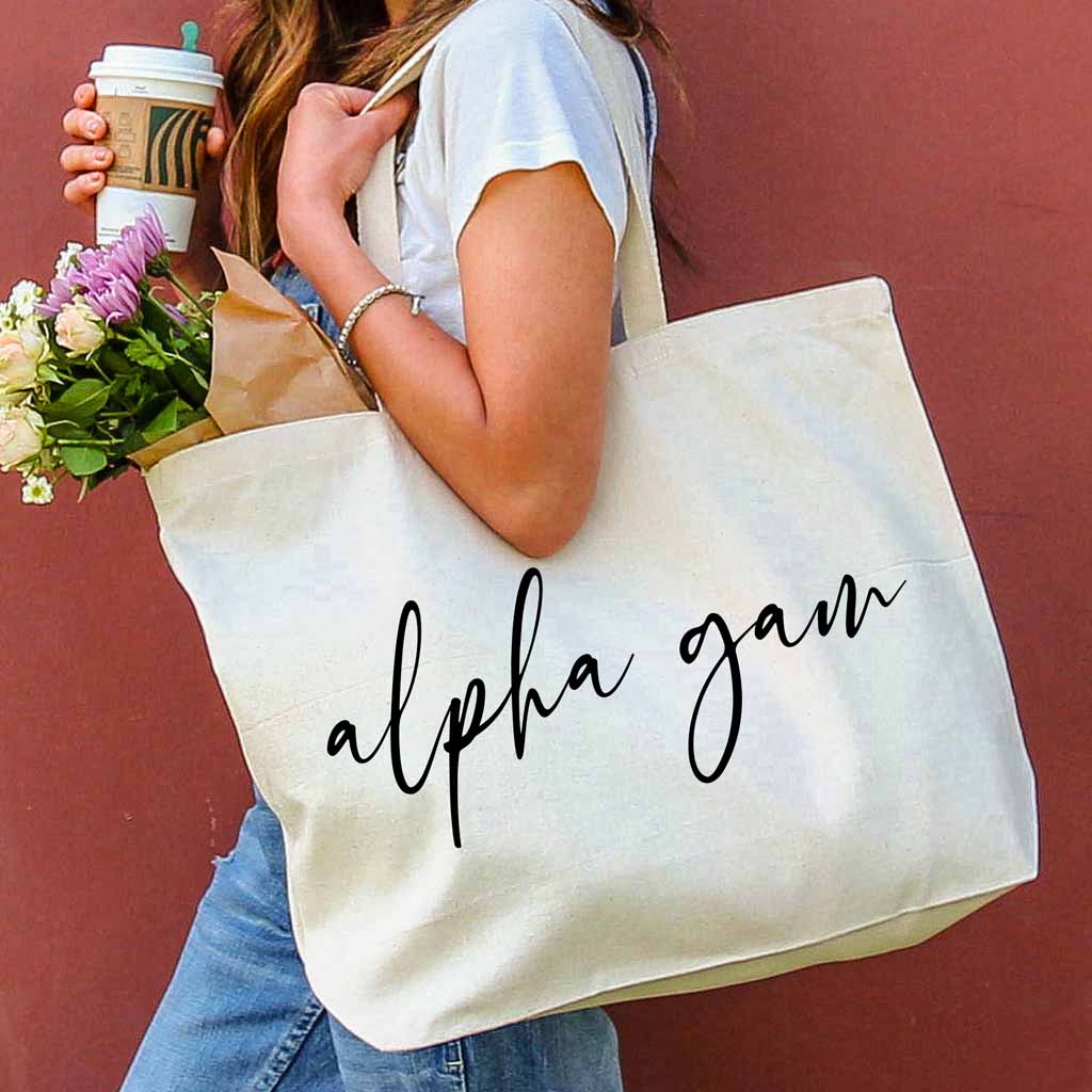 Alpha Gam sorority nickname digitally printed on canvas tote bag in script writing is a the perfect accessory for the new semester.