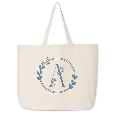 Large monogrammed bridesmaid tote bag personalized with a floral theme design.