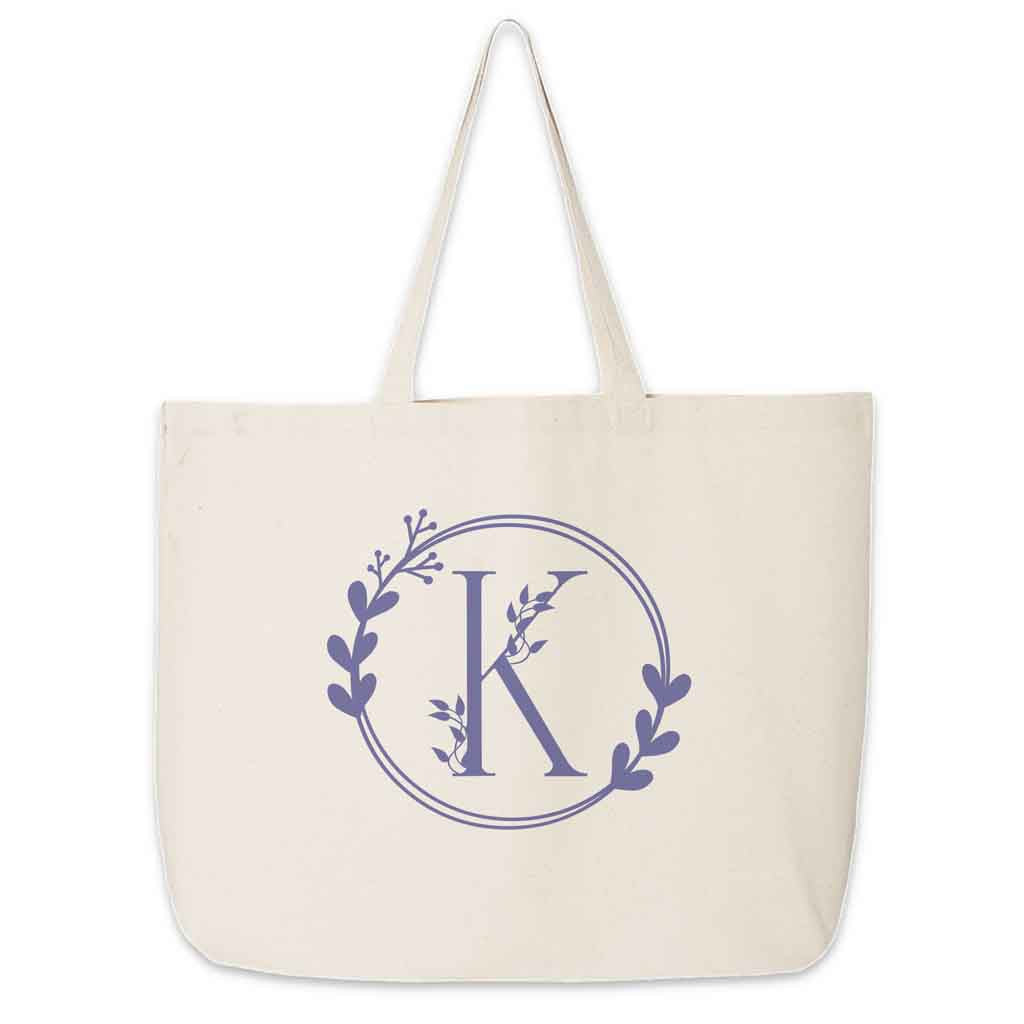 Large monogrammed bridesmaid tote bag personalized with a floral theme design.