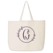 Large monogrammed bridesmaid tote bag personalized with a floral theme design.