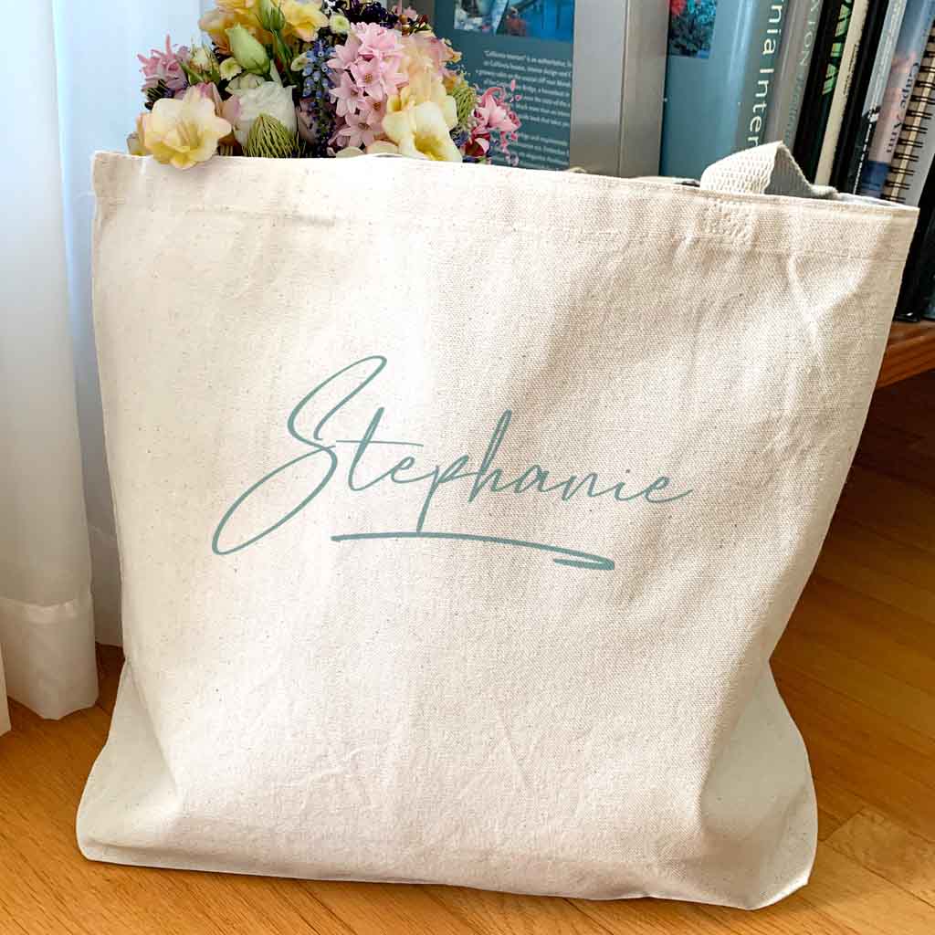 Roomy canvas tote bag for the bridal party personalized with a name.
