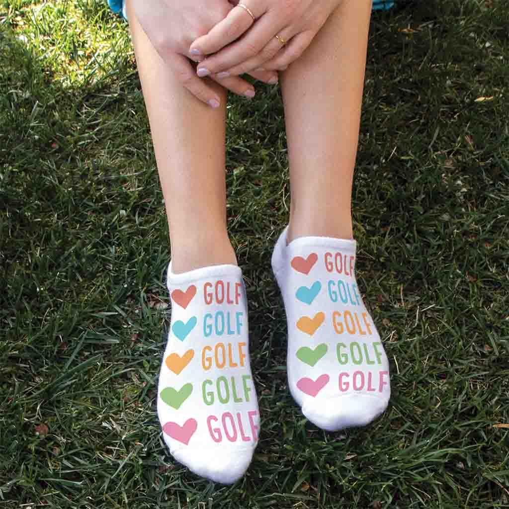 These cotton blend 1/2 cushion no show socks are digitally printed on the top of the white socks with colorful hearts and golf design. 