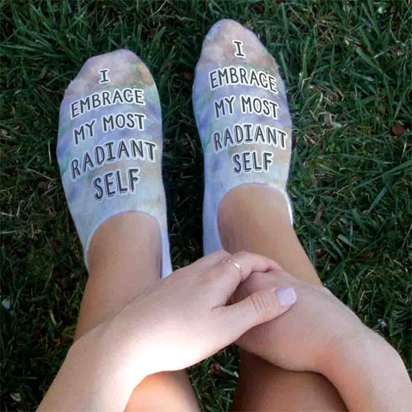I embrace my most radiant self positive affirmation printed on no show socks.