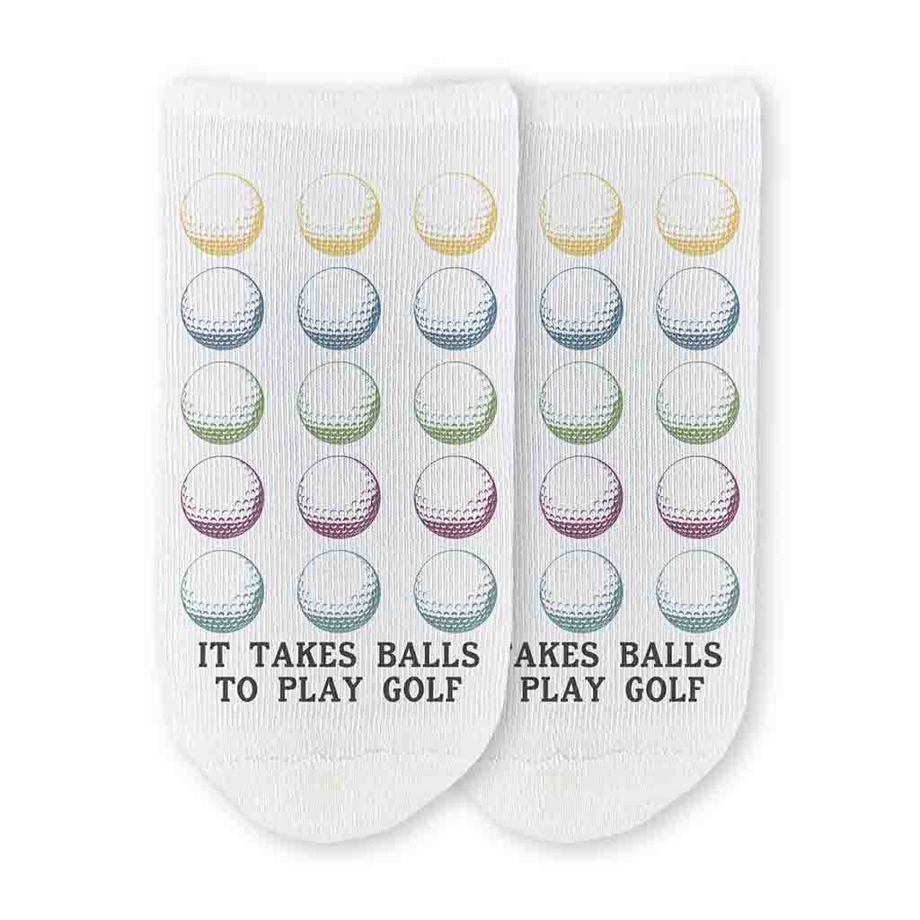 The perfect gift for your favorite golfer these it takes balls to play golf with golf digitally printed with golf ball design on white cotton no show socks.