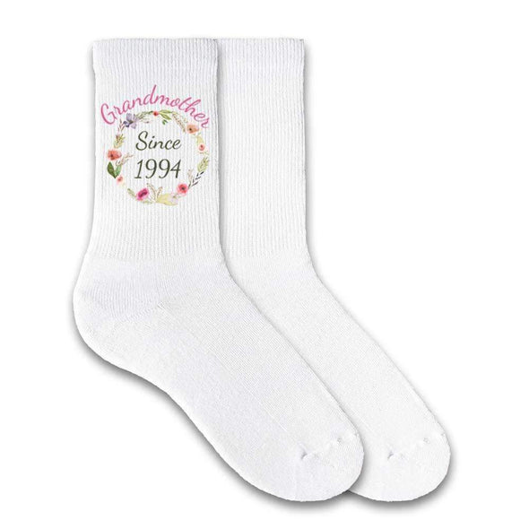 Grandmother since and the year with a floral design custom printed on white cotton crew socks.