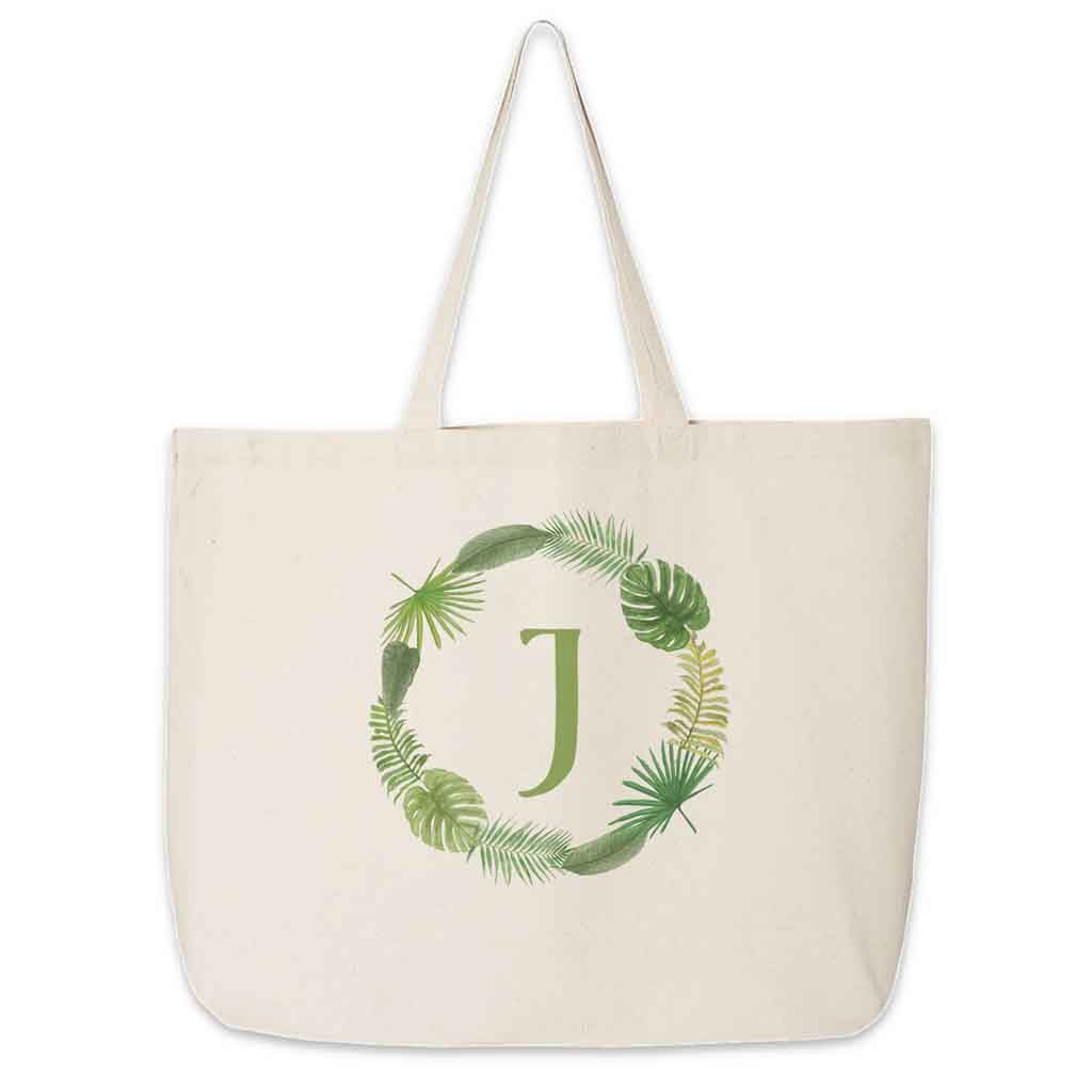 Large canvas tote bag personalized monogram with a tropical leaf design.
