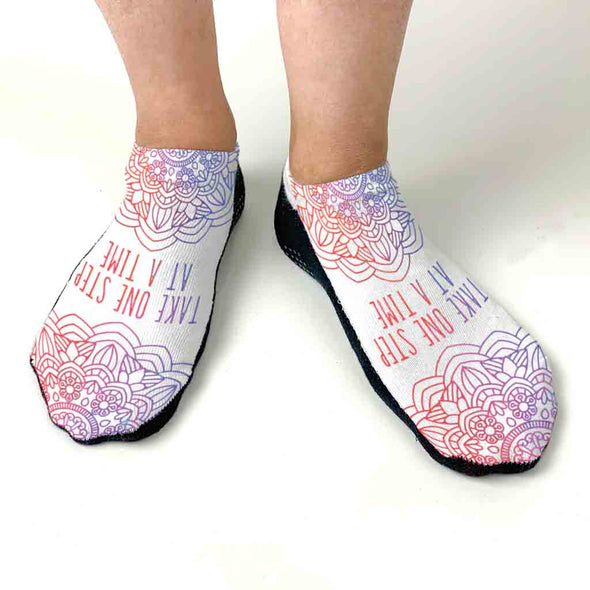 White cotton no show socks with gripper soles digitally printed with self affirmation take one step at a time design.