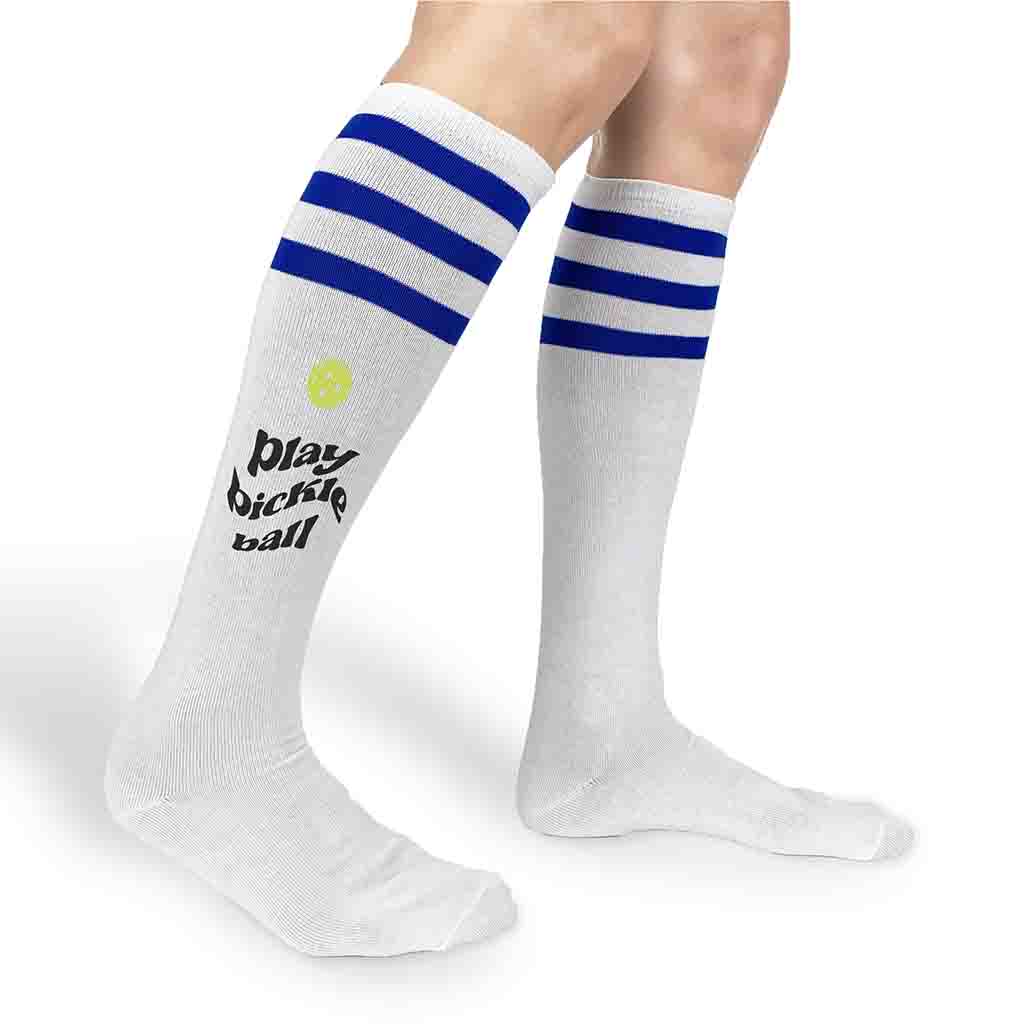 Play pickleball design by sockprints digitally printed on the side of the knee high socks.