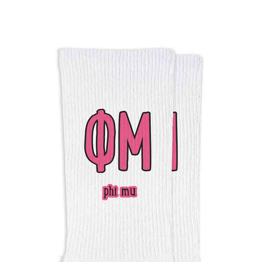 Phi Mu sorority letters and name digitally printed in sorority colors on white crew socks.