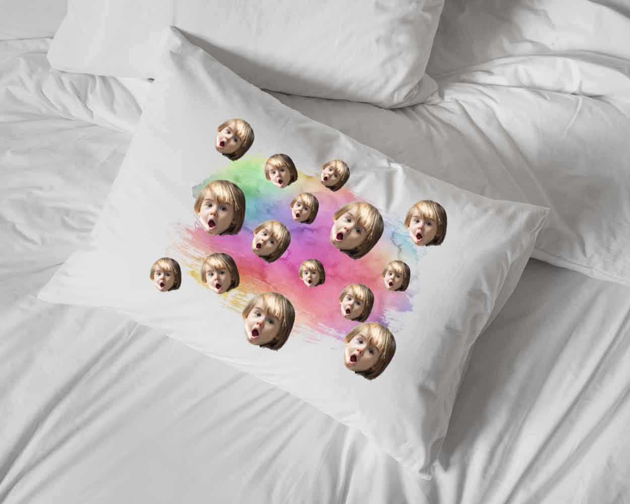 Rainbow wash design and all over cropped photo faces digitally printed in ink on white cotton standard pillowcase makes the perfect sleepover pillow.