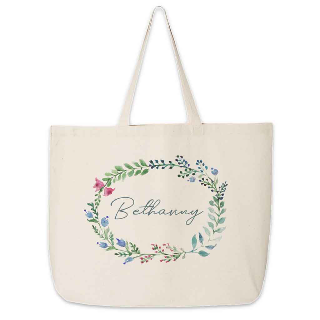 Large canvas tote bag for the wedding party personalized name in a farmhouse floral theme.