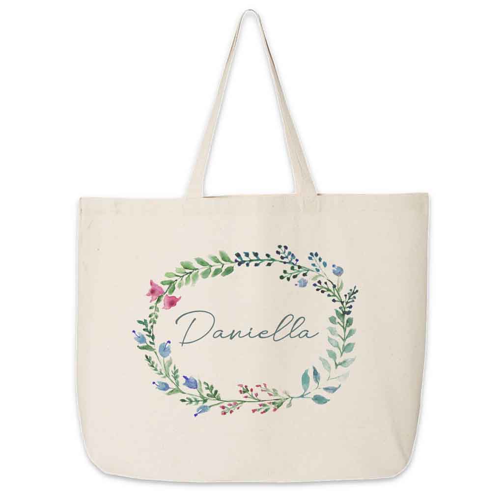 Large canvas tote bag for the wedding party personalized name in a farmhouse floral theme.