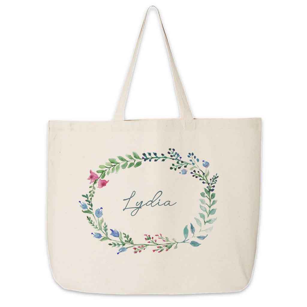 Large canvas tote bag for the wedding party personalized name in a farmhouse floral theme.