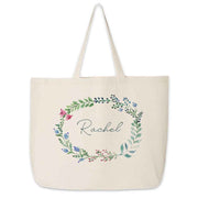 Large canvas tote bag for the wedding party personalized name in a farmhouse floral theme.