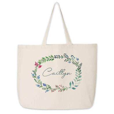 Large canvas tote bag for the wedding party personalized name in a farmhouse floral theme.