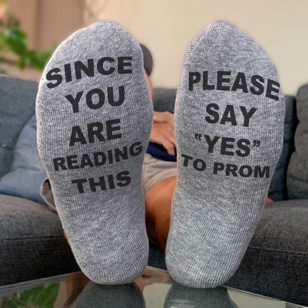 Since you are reading this please say yes to prom custom printed in black ink on the bottom soles of the heather gray or white cotton crew socks.