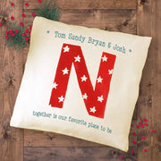 Custom printed holiday pillow with monogram and name printed on pillow cover.