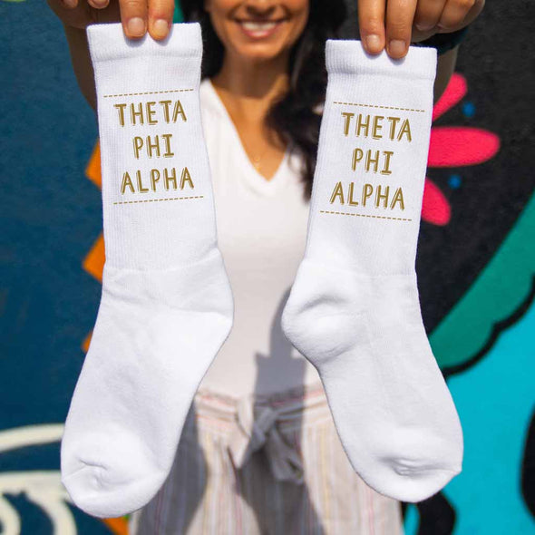 Theta Phi Alpha sorority name in sorority color digitally printed on comfy white cotton crew socks