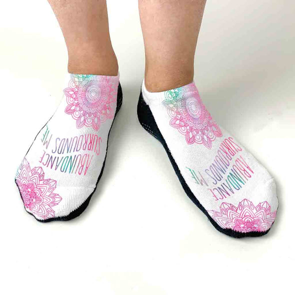 Comfortable white cotton no show gripper sole socks digitally printed with positive and affirming mantra abundance surrounds me.