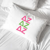 Delta Zeta sorority letters digitally printed in sorority colors on standard white cotton pillowcase.