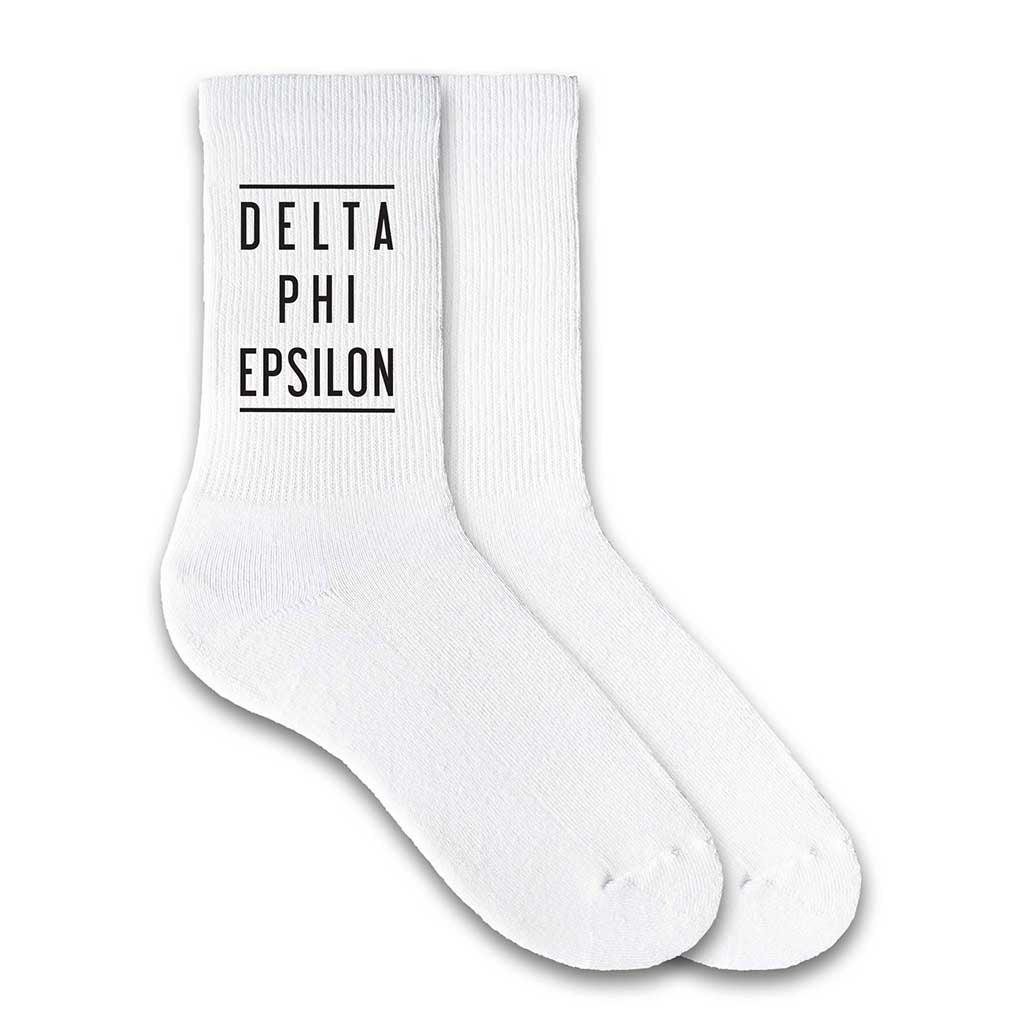 Delta Phi Epsilon sorority white cotton crew socks with sorority name printed on the socks