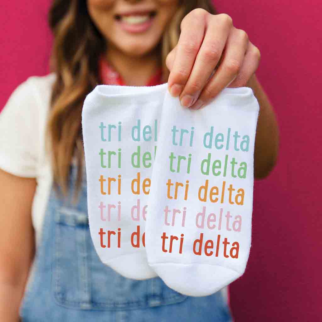 Delta Delta Delta sorority repeating rainbow letter design custom printed on comfy cotton no show socks