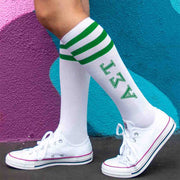 Alpha Sigma Tau sorority letters digitally printed in green ink on cute cotton green striped knee high socks