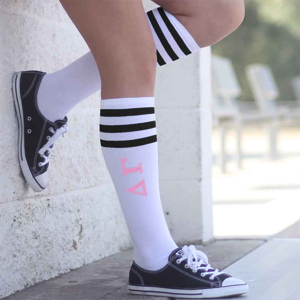 Cute Delta Gamma black striped knee high socks custom printed in pink with greek letters