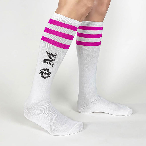 Phi Mu sorority letters custom printed on fuchsia striped knee high socks