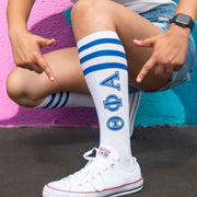 Theta Phi Alpha sorority letters digitally printed on royal blue striped knee high socks