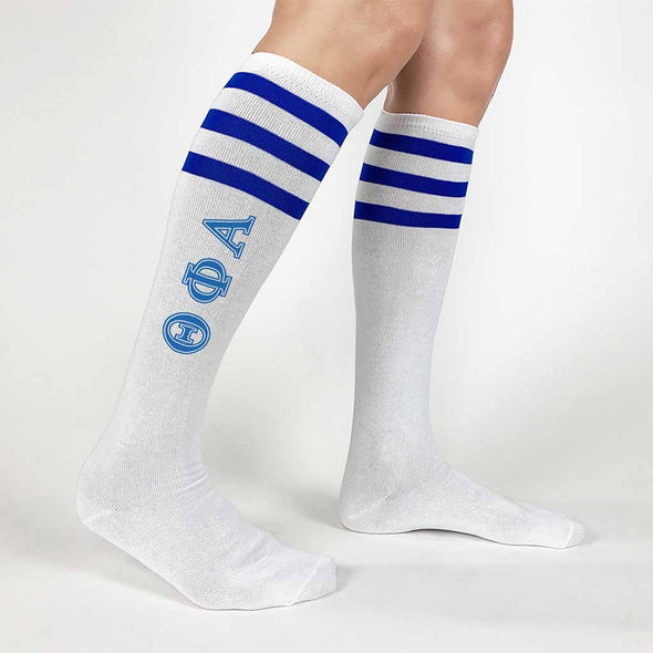 Theta Phi Alpha sorority letters custom printed on royal blue striped knee high socks
