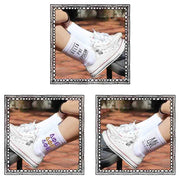 Delta Phi Epsilon white crew socks with sorority name and Greek letters sold as a 3 pair sock bundle