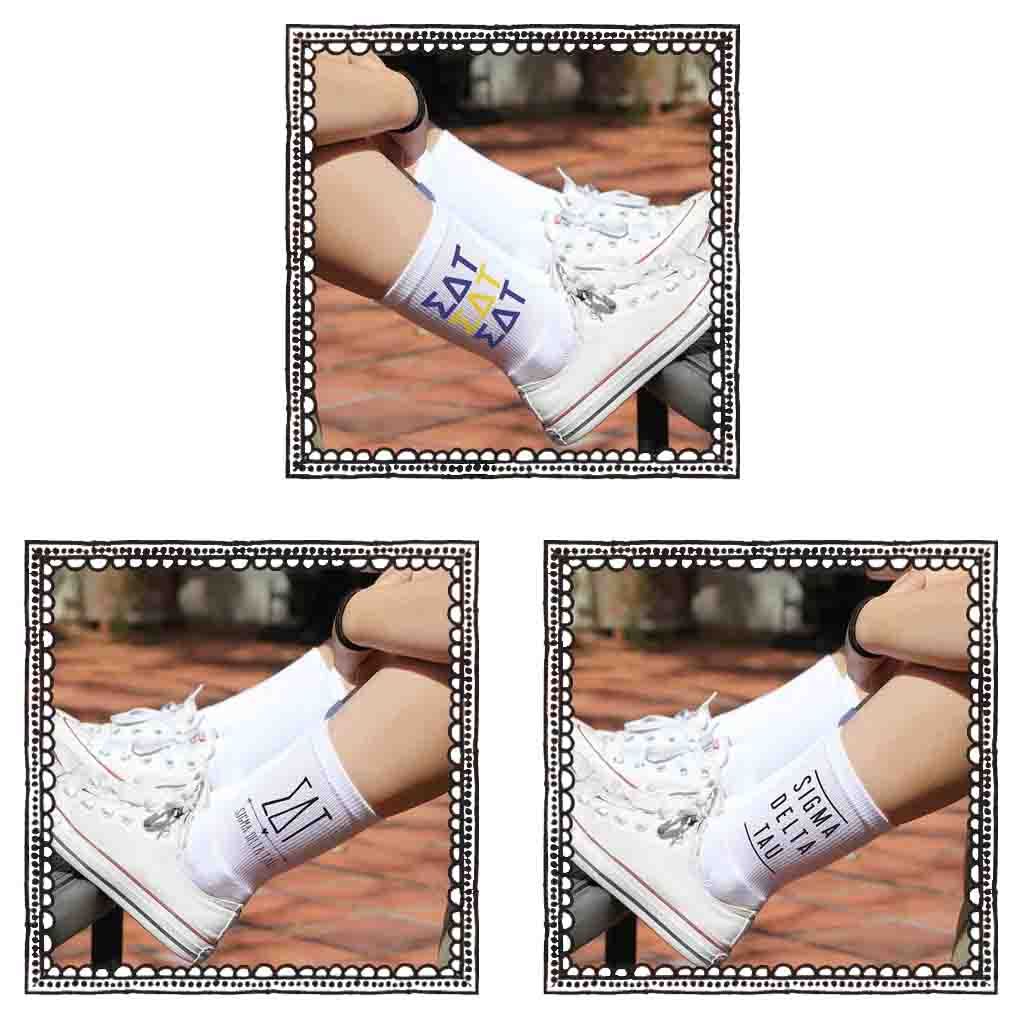 Sigma Delta Tau white crew socks with sorority name and Greek letters sold as a 3 pair sock bundle