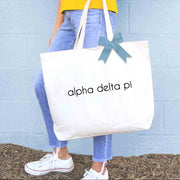 Sorority name custom printed on canvas tote bag with bow in sorority color available for all 26 NPC organizations