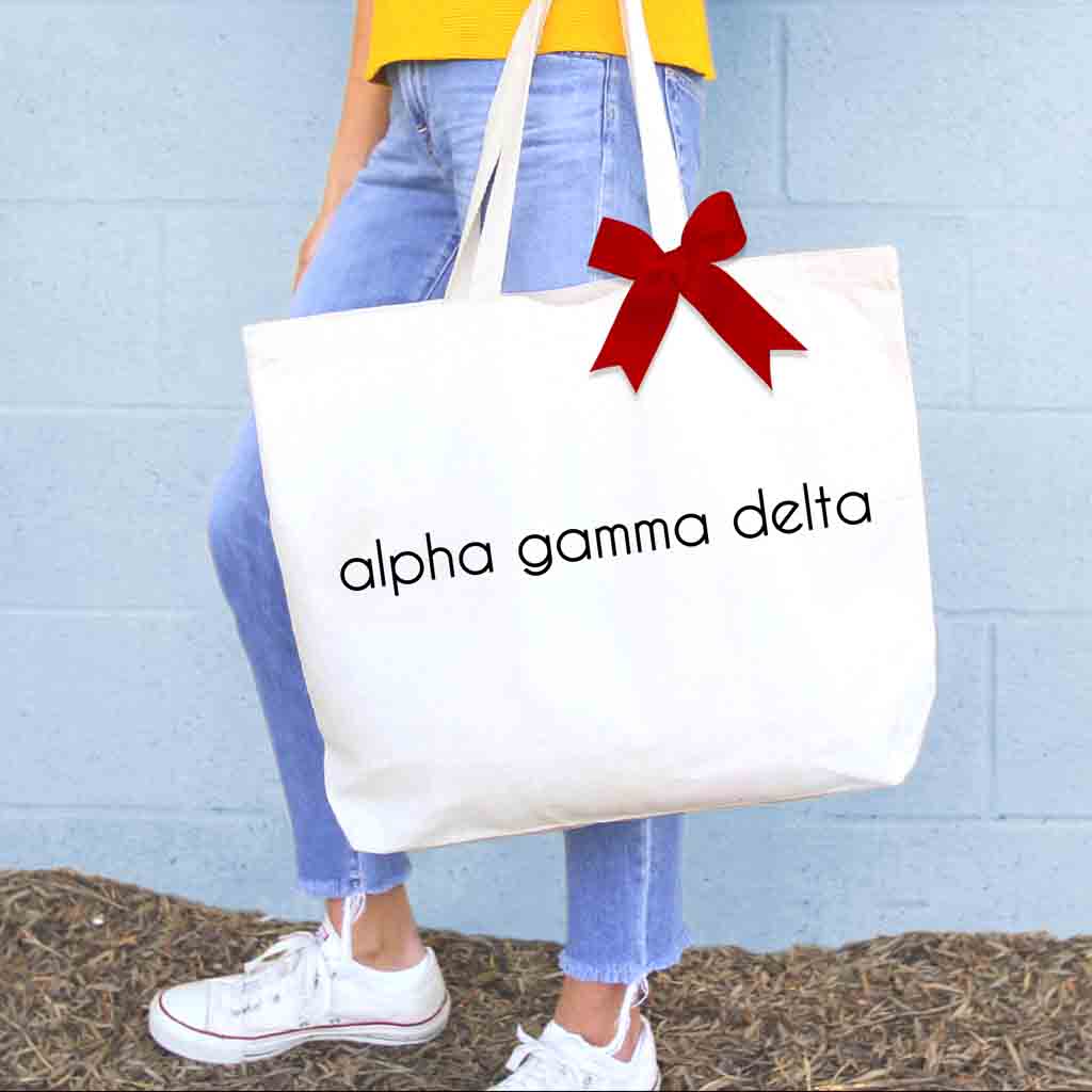 Alpha Gamma Delta sorority name custom printed on cute canvas tote bag with bow