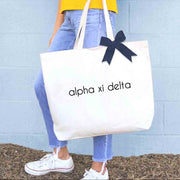 Alpha Xi Delta sorority name custom printed on canvas tote bag wit bow