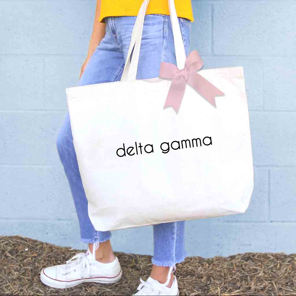 Delta Gamma custom printed on canvas tote bag with a bow in sorority color